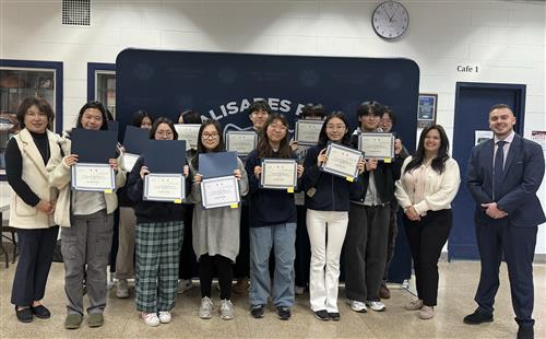  PPHS students holding their awards from the Korean Writing Contest
